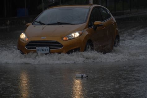 Fuertes lluvias causan inundaciones en calles de Cancún PorEsto