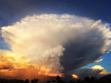 Apocalyptical anvil cloud at sunset swallows up Chinchilla, Australia ...