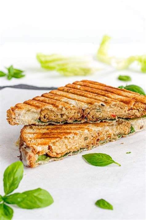 Grilled Chicken Panini Sandwich With Nuggets Garnished With Fresh Basil