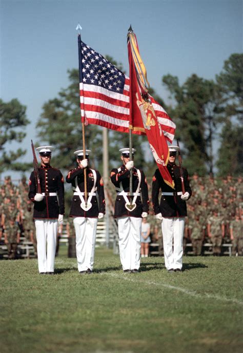 The Marine Corps Color Guard Dips The Battle Colors In Honor During A