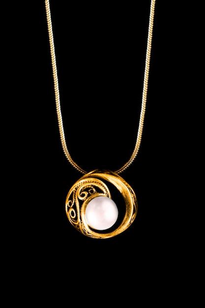 Premium Photo | Elegant vintage pearl pendant hanging on gold chain ...