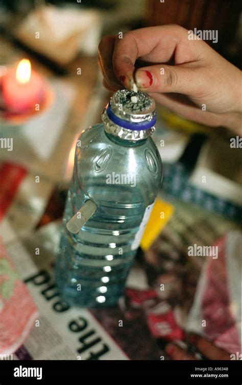 Addict preparing to smoke crack cocaine from a specially prepared Stock ...