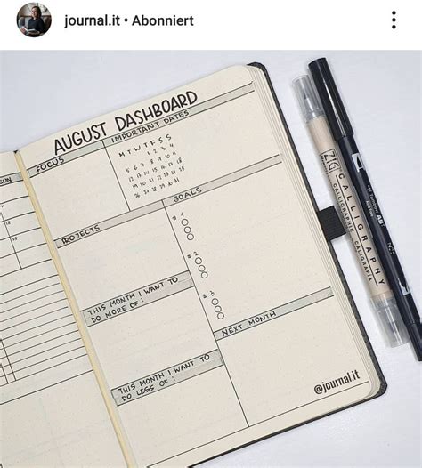 An Open Planner And Pen Sitting On Top Of A Desk