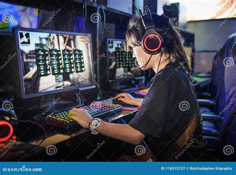 Young Teen Girl Playing Computer Games in Internet Cafe Stock Image ...