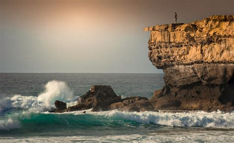 Man Standing on Rock Hill · Free Stock Photo