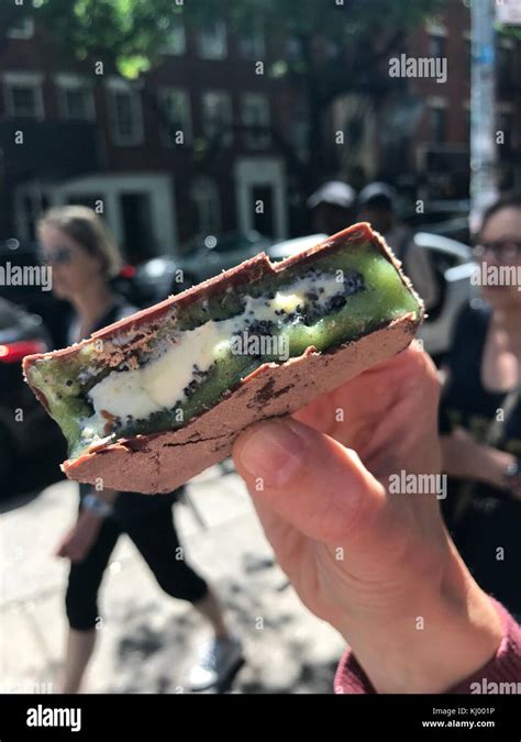 New York Usa 03rd June 2017 A Person Presents A Kiwi Ice Cream Sandwich With A Vanilla Ice