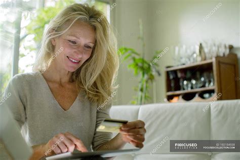 Mature Woman Using Digital Table To Shop Online Online Banking Use Stock Photo