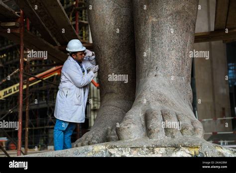 Egyptian Workers Restore A Giant Granite Statue Of The Ancient Egyptian