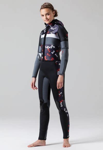 A Woman In A Wetsuit With Skulls On The Side And Black Body Standing