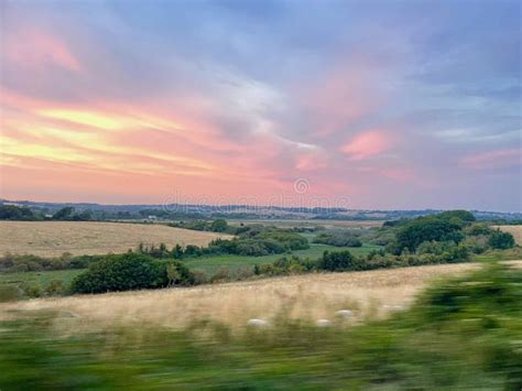 Sunset Over Hills And Fields Stock Photo Image Of Sunset Grass