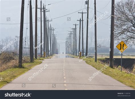 Country Road Through Farmland Horizontal Stock Photo 11109745