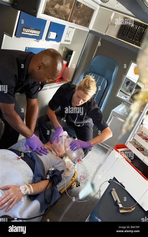 Paramedics Performing CPR On Patient In Ambulance Stock Photo Alamy