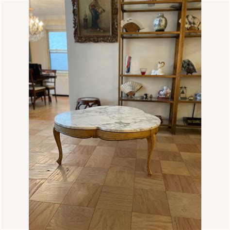 Cloverleaf Coffee Table With A Marble Top AptDeco