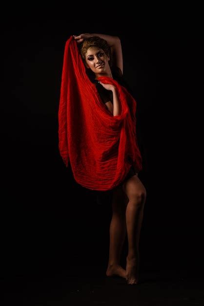 Premium Photo Portrait Of Woman Standing Against Black Background