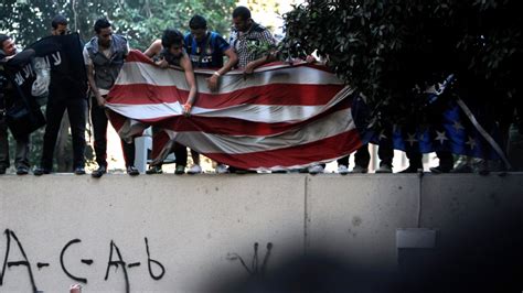 Egyptian Protesters Scale U S Embassy Wall In Cairo Bring Down Flag Ctv News