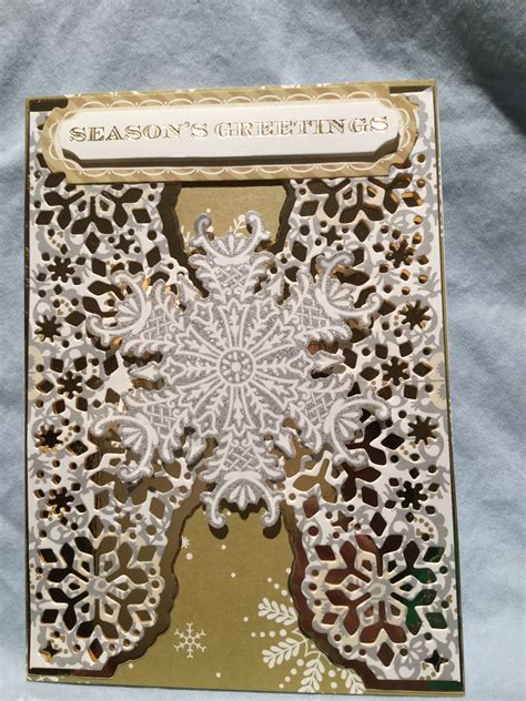 An Ornate Card With Snowflakes On It