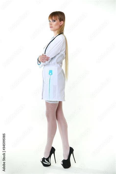 Sexy Woman Doctor With A Stethoscope Standing On White Background Sexy Nurse In A White