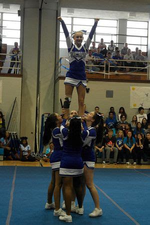 The cheerleaders took new risks with their stunt routine at the Fall ...