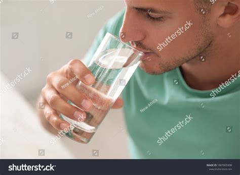 Man Drinking Glass Of Water