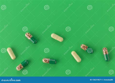 Various Capsules With Antibiotics On A Green Background Stock Image