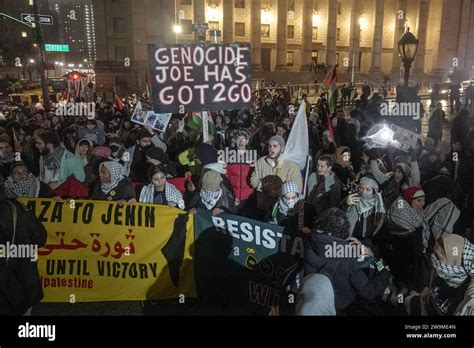 The Demonstrators Hold Placards Flags And Banners During The