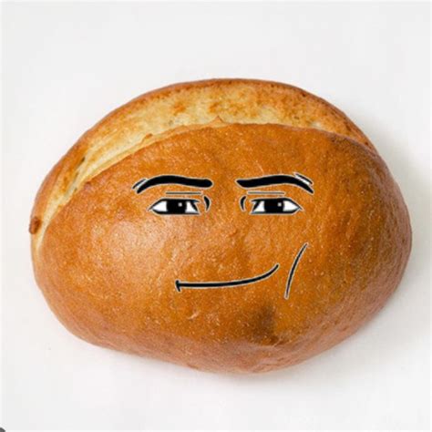 A Loaf Of Bread With A Face Drawn On It