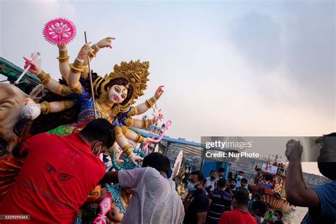 Hindu Devotees Submerge A Clay Idol Of The Hindu Goddess Durga On The