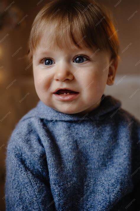 Cute Baby With Blue Eyes And Brown Hair