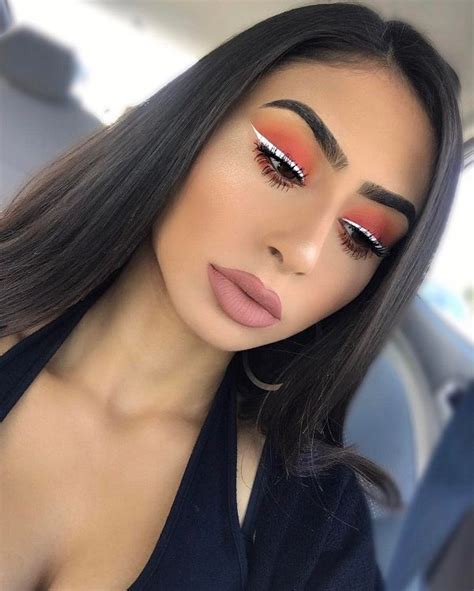 Warm Sunset On The Eyelids Is Combined With Cold White Eyeliner White