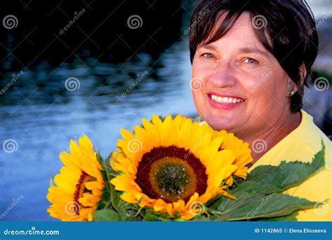 Woman Sunflowers Stock Image Image Of Middle Flowers 1142865