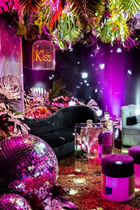 A Living Room Filled With Furniture And Disco Balls