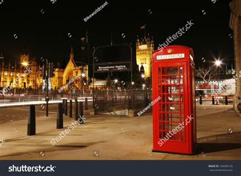 Red Telephone Booth At Night Victoria Tower In The Distance Red Phone