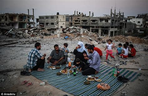 Ramadan In Gaza Families Pictured Breaking Their Fast Among The Rubble