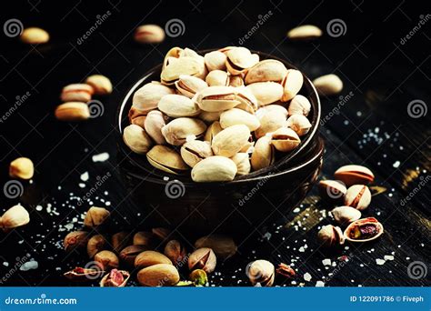 Salted Pistachios In A Bowl Black Background Selective Focus Stock