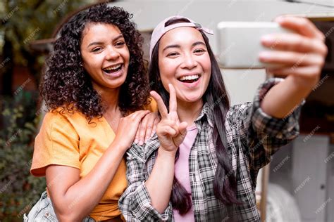 Free Photo Happy Female Friends Taking A Selfie