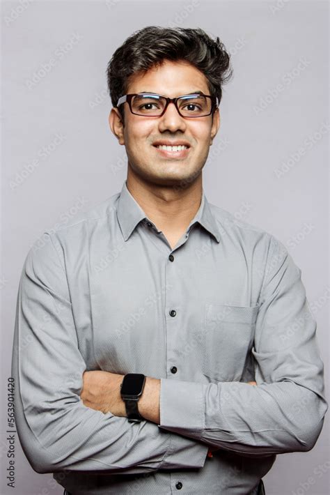 Young Sophisticated Indian Handsome Adult Wearing A Shirt And Glasses