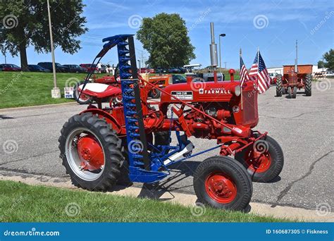 Farmall Cub Tractor Restored And With A Hay Mower Editorial Image