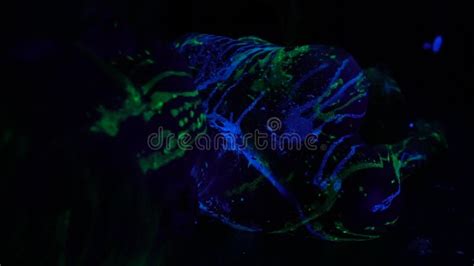 A Girl In Fluorescent Paint Lies Naked On The Floor In The Dark Stock Video Video Of