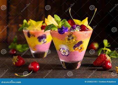 Delicious Layered Berry And Fruit Smoothie With Edible Flowers Healthy