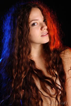 Long Haired Curly Haired Brunette In Pink Poses On Black XXX Dessert