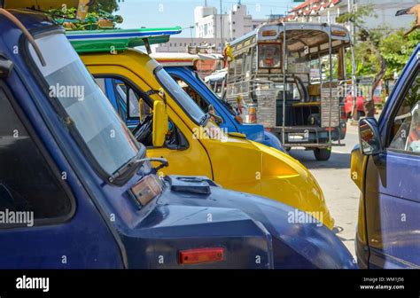 Colorful Cars Parked In A Busy Street Stock Photo Alamy