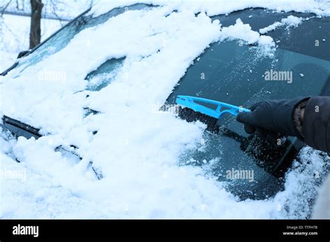 Removing Snow From Car Windshield Closeup Stock Photo Alamy