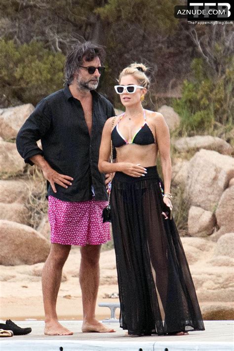 Sylvie Meis Sexy Seen Flaunting Her Hot Figure Wearing A Bikini Top At The Beach In Sardinia