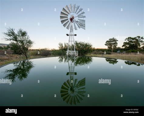 Farm Dam And Windmill In Merweville In The Karoo Region Of South Africa