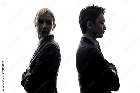 Silhouette Of Man And Woman Standing Back To Back Stock Photo Adobe