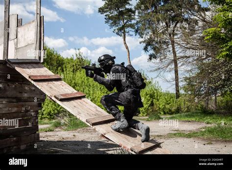 Spec Ops Police Officer Swat In Black Uniform In Action Stock Photo Alamy