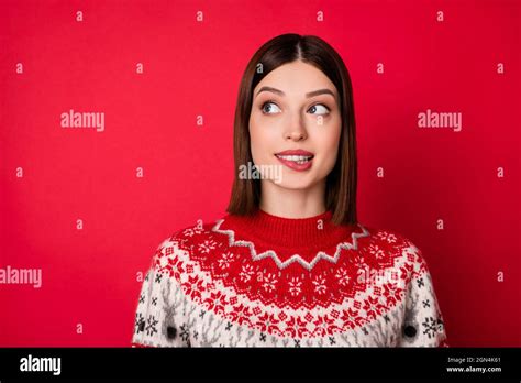 Photo Of Funny Doubtful Young Lady Wear Print Sweater Biting Lip