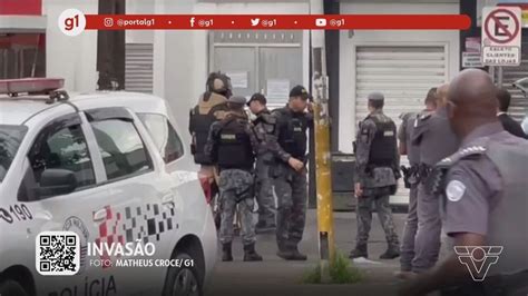 G1 em 1 Minuto Santos Criminosos invadem agência bancária e praça