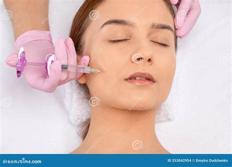 Cosmetologist Makes Rejuvenating Anti Wrinkle Injections On The Face Of