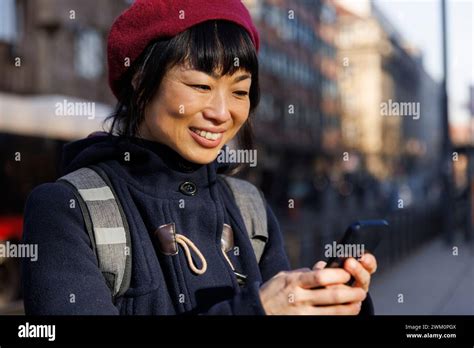 Mature Woman Using Smart Phone Cap Hi Res Stock Photography And Images Alamy